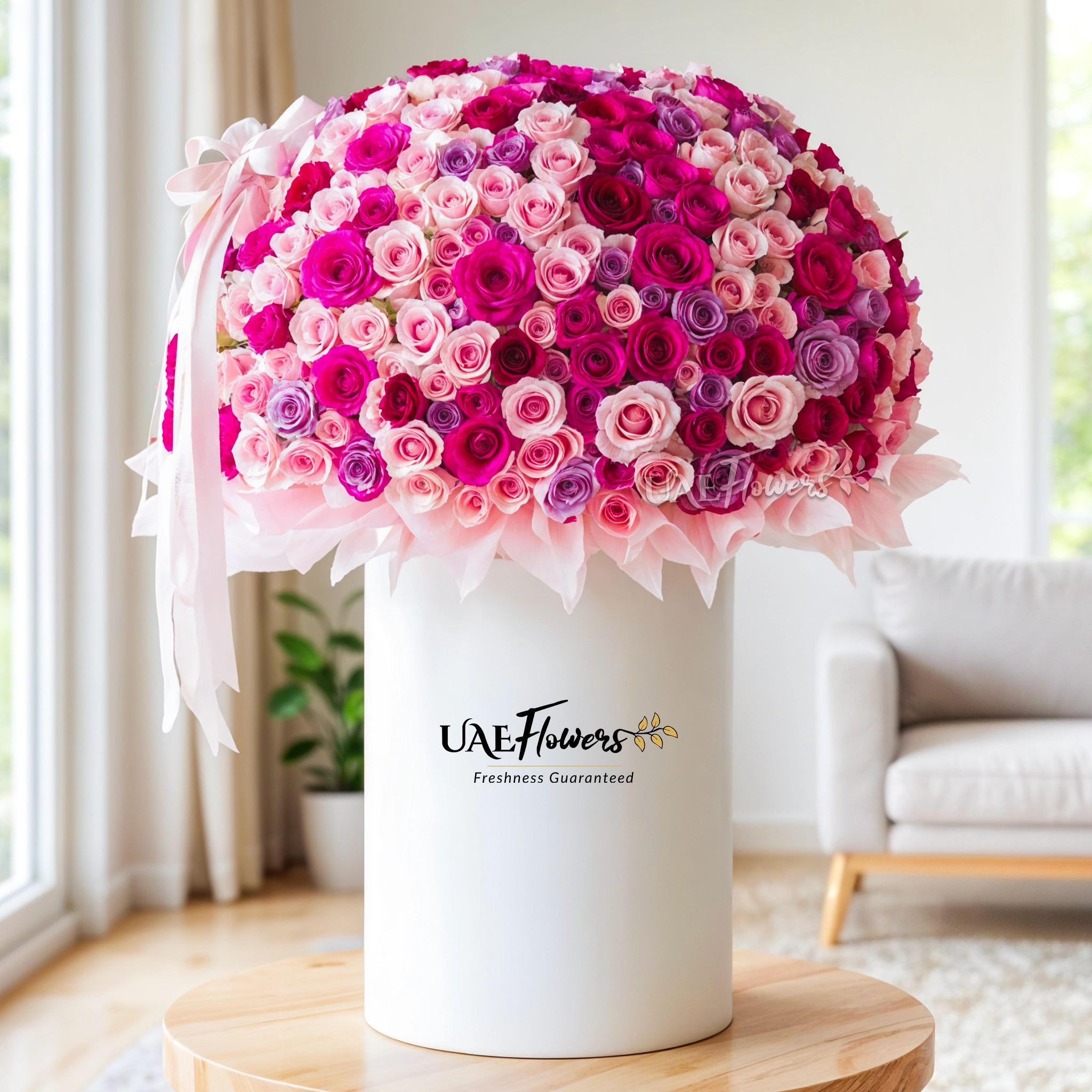Full round arrangement of 300 Red, Pink & Purple Roses in a tall round box.