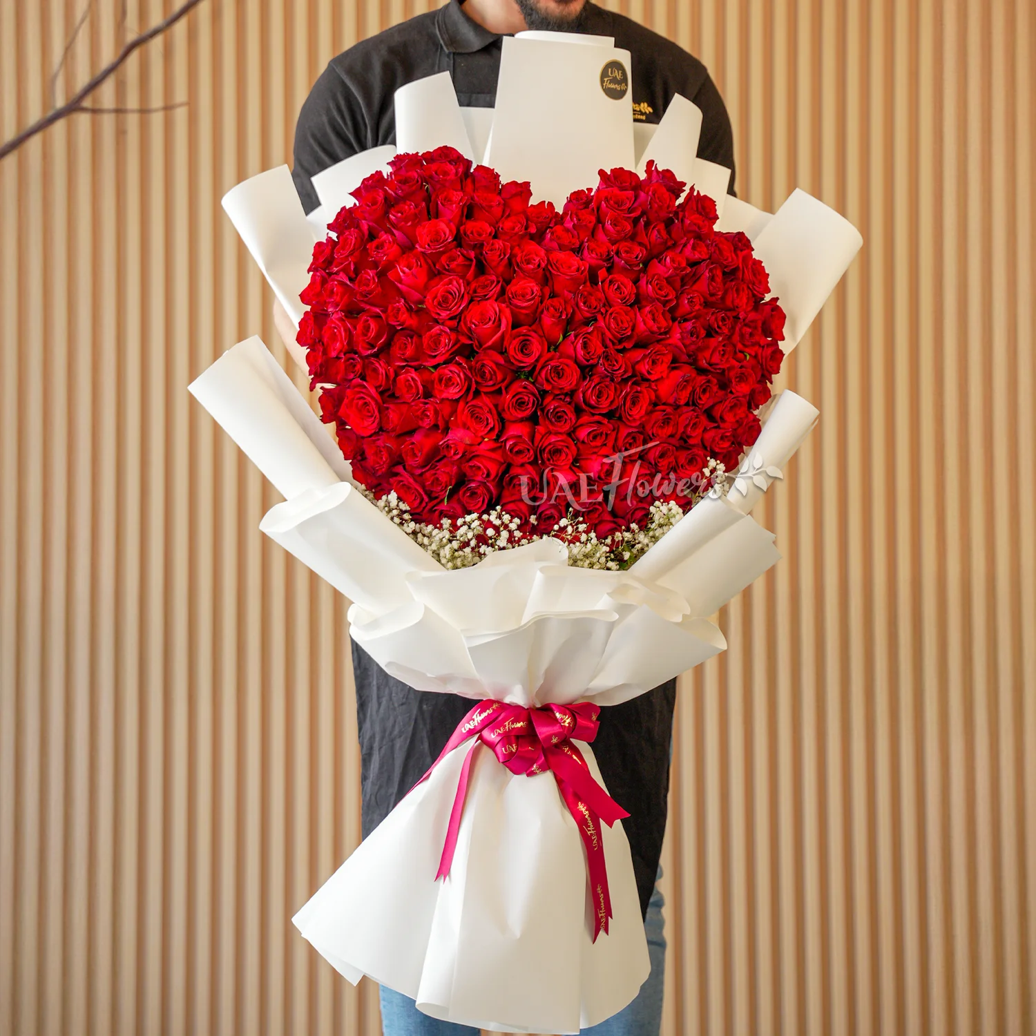 150 red roses with baby’s breath fillers, wrapped in elegant paper