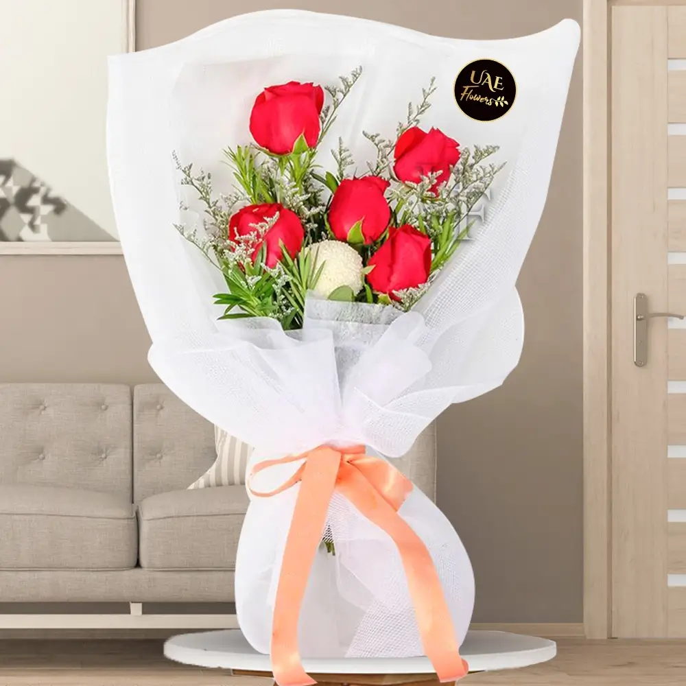 5 red roses, 1 white ping pong, purple caspia,