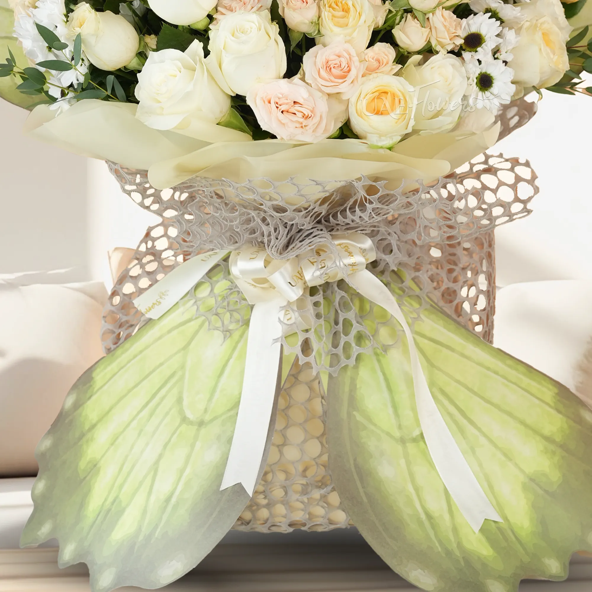 butterfly-shaped bouquet with 8 white roses, 8 pink roses, 4 pink gerberas