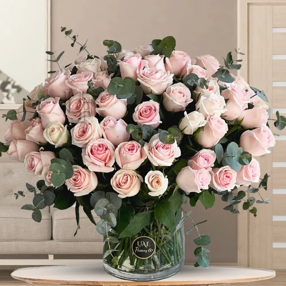50 pink roses with eucalyptus leaves in a glass vase 50 pink roses with eucalyptus leaves in a glass vase