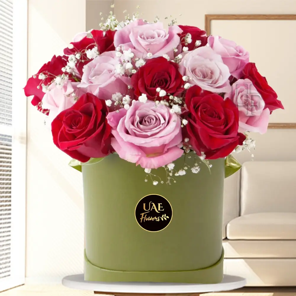10 pink and 10 red roses with fillers arranged in a box.