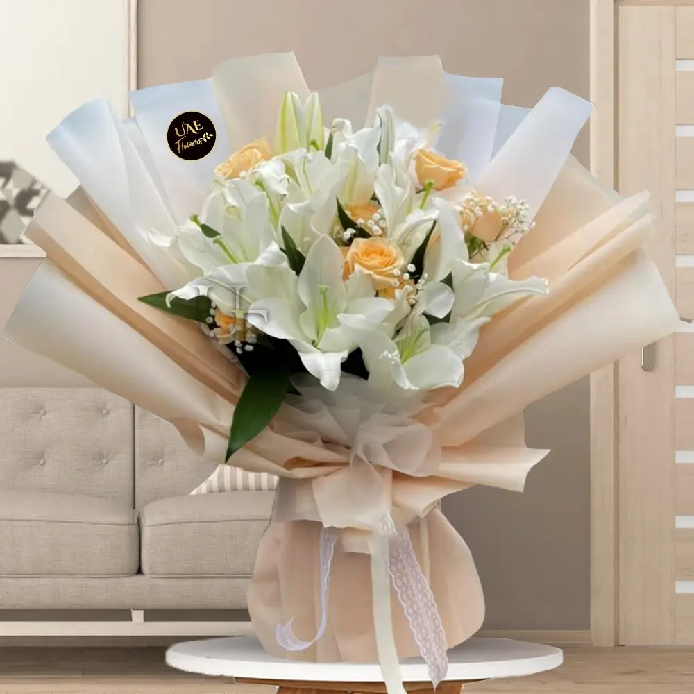 white lilies and 10 peach roses