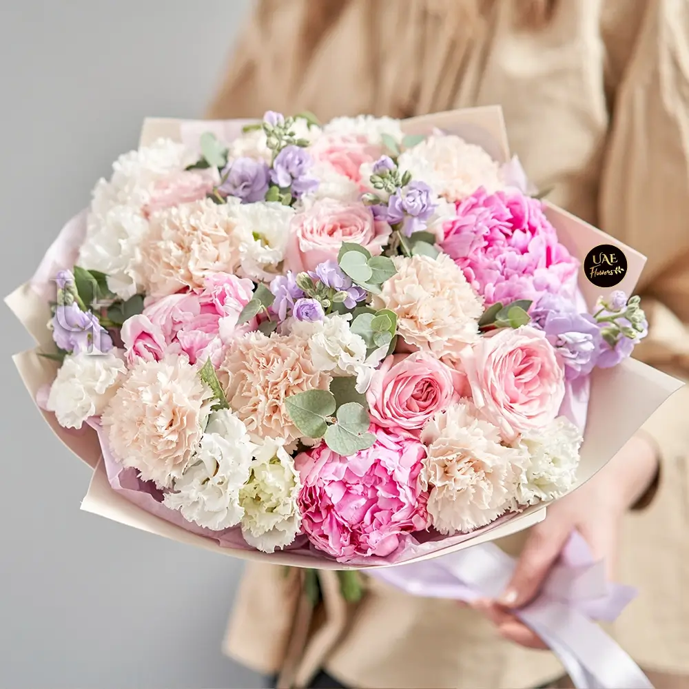 pink peonies roses peach carnations arrangement