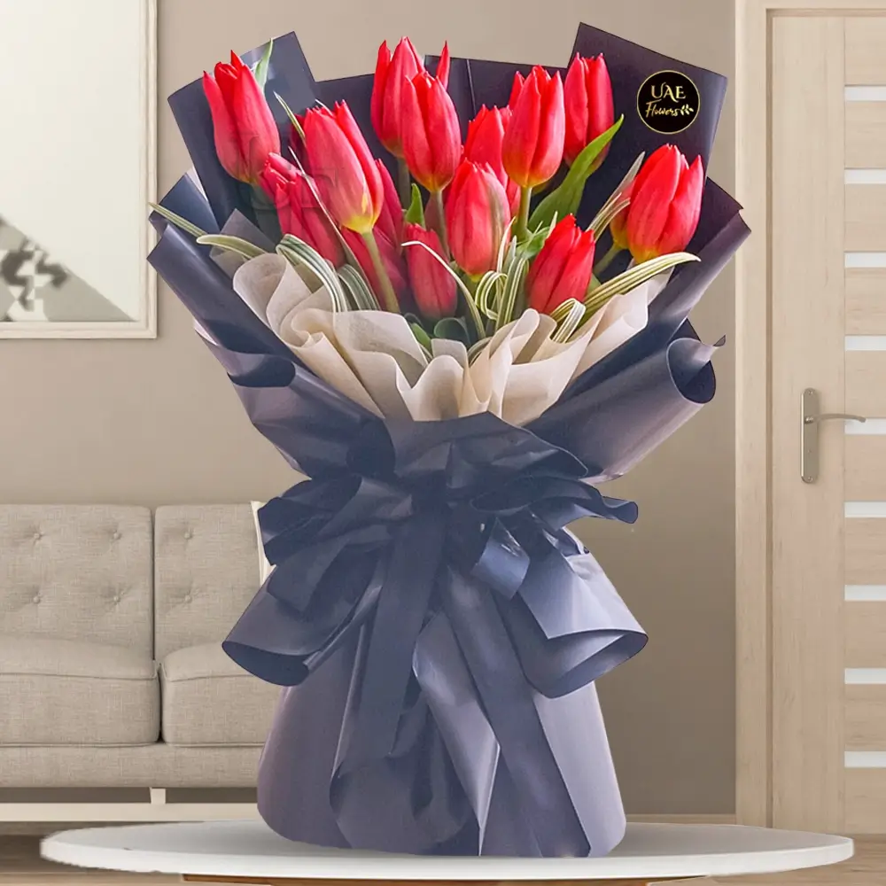 Red tulip bouquet in luxury black wrapping with ribbon, perfect for gifting
