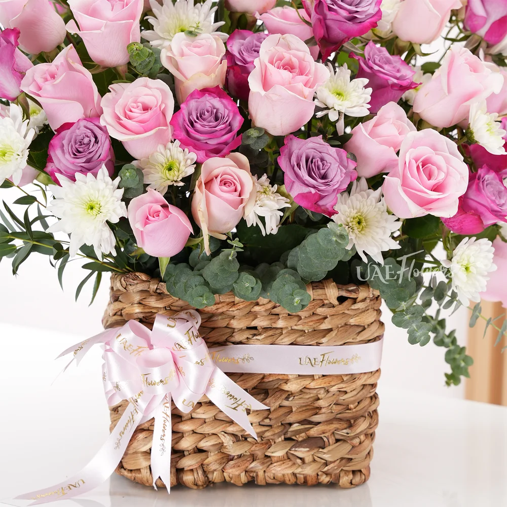 Basket Arrangement featuring 40 purple and pink roses
