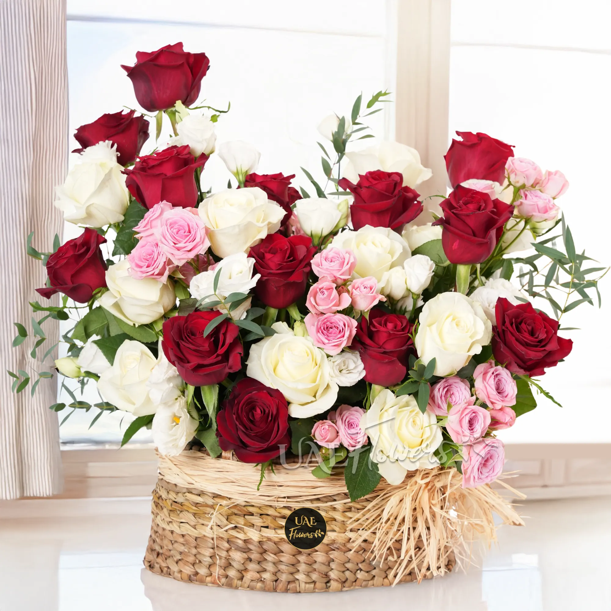 basket arrangement with 20 red and white roses, 6 pink spray roses