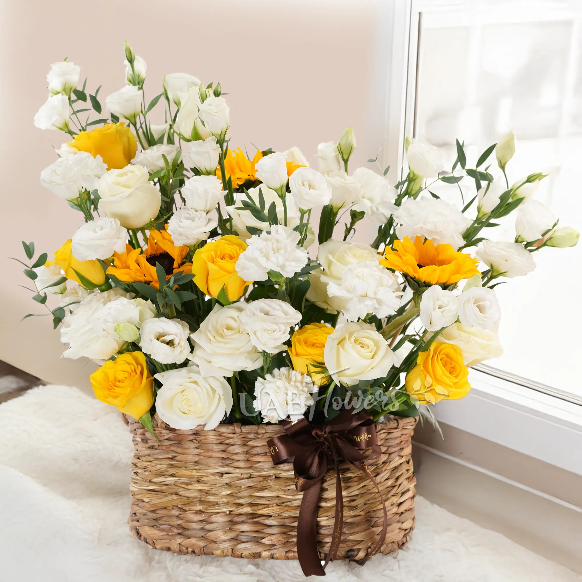 6 white roses, 6 yellow roses, 10 white lisianthus, 2 sunflowers