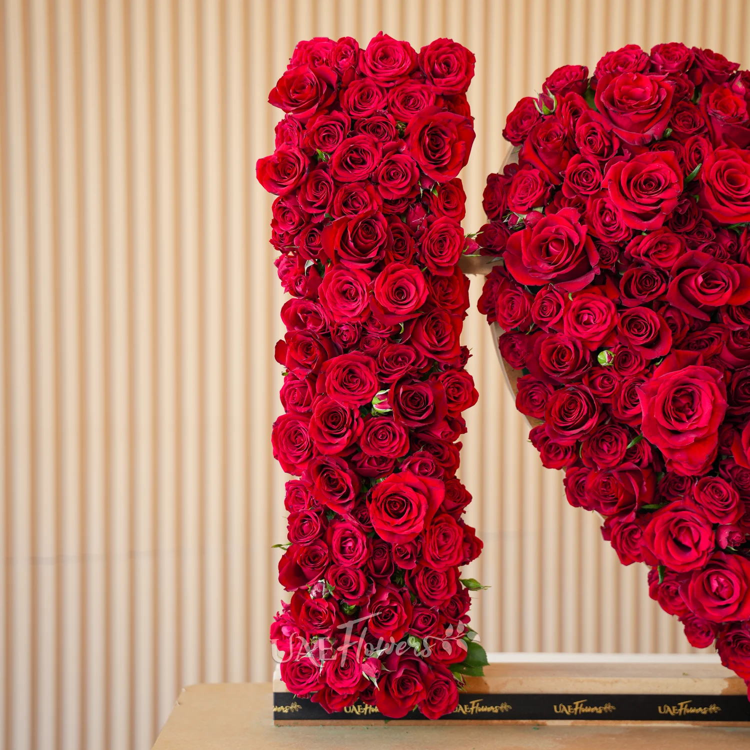 350 to 400 red spray rose buds arranged in an I Love You shape