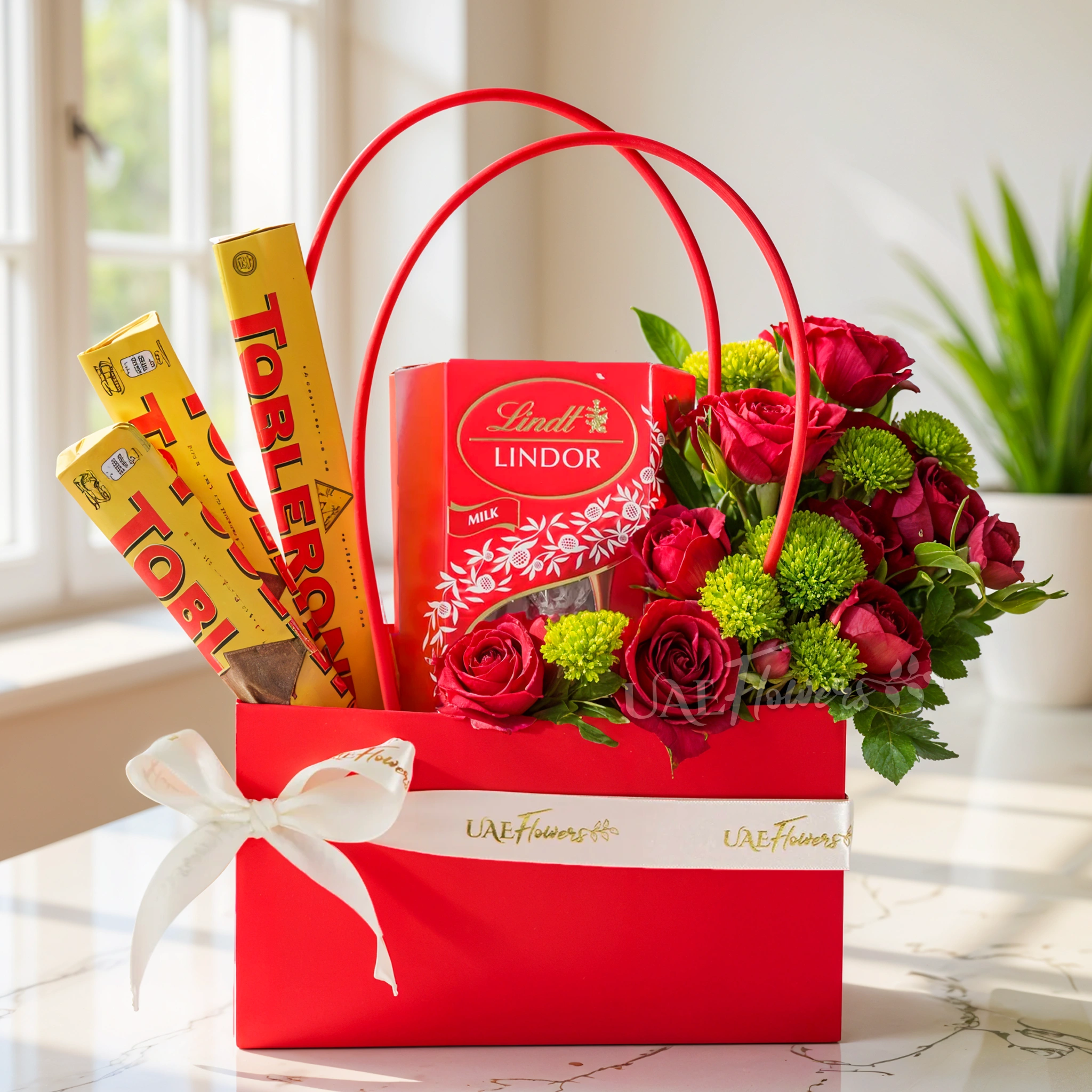 gift bag with 10 red roses, green button chrysanthemums, 3 Toblerone, and 200g Lindt milk chocolate