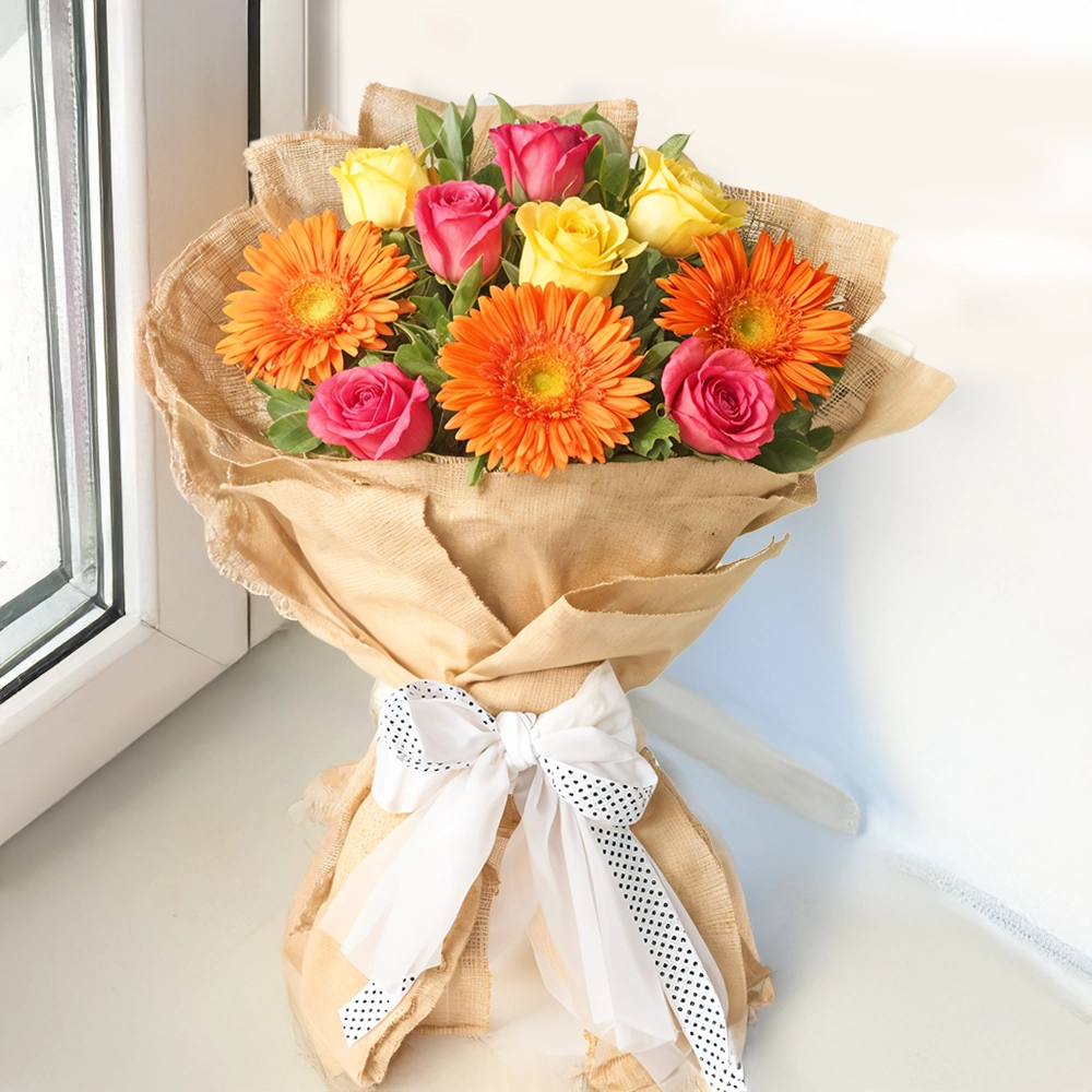 4 pink roses, 3 yellow roses, 3 orange gerberas