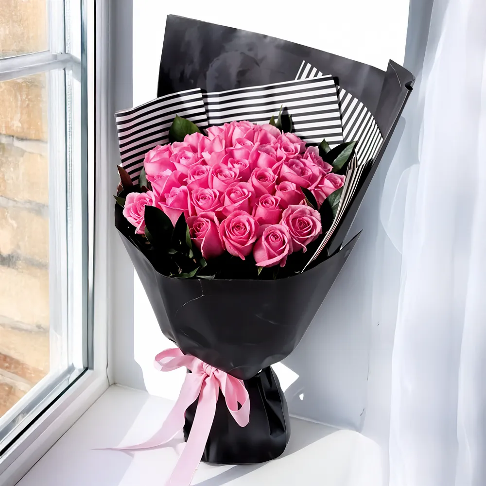 30 pink roses with fillers, wrapped and tied with a ribbon