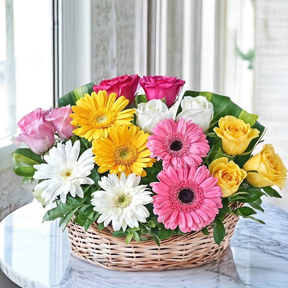basket of 2 pink, 2 yellow, 2 white gerberas and 12 mixed color roses