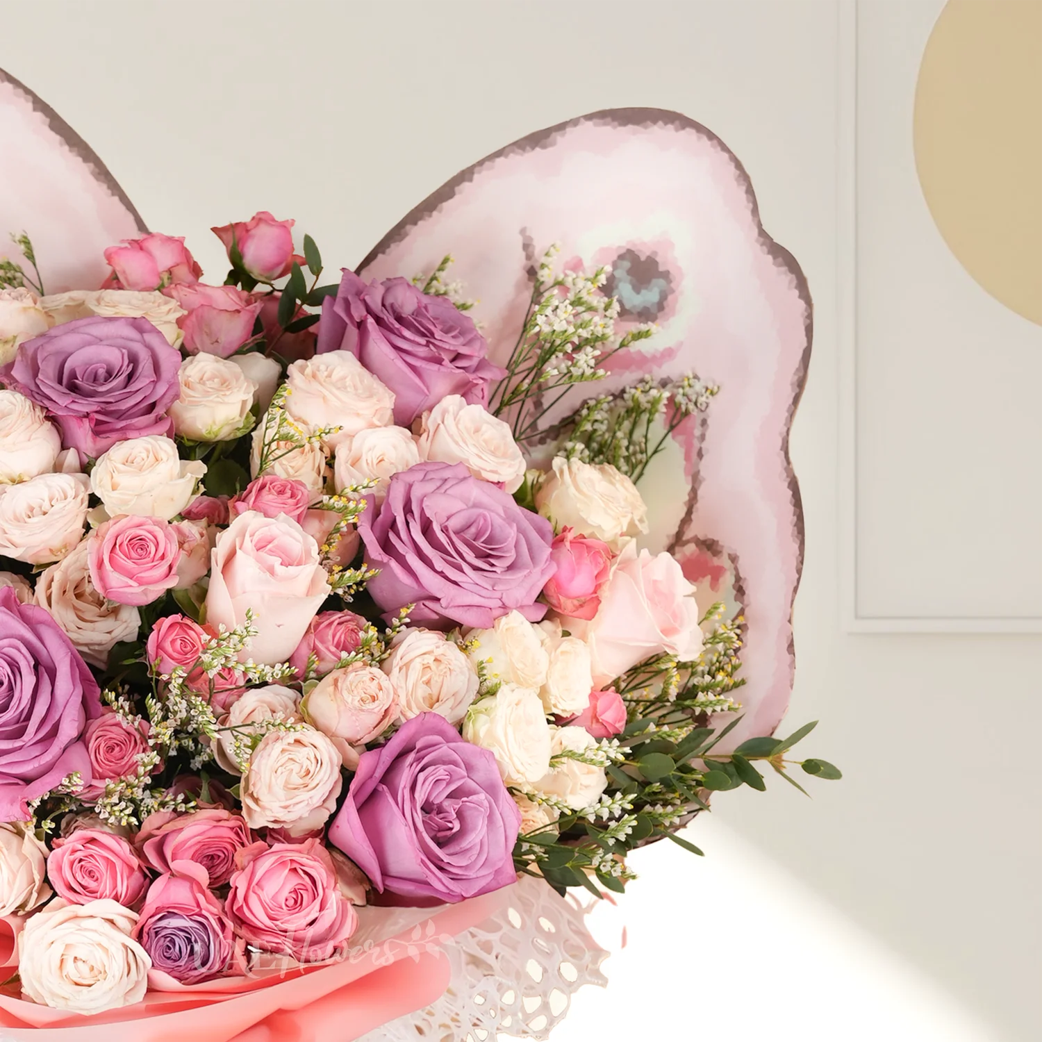 6 purple, 4 pink, and 10 pink and peach spray roses.