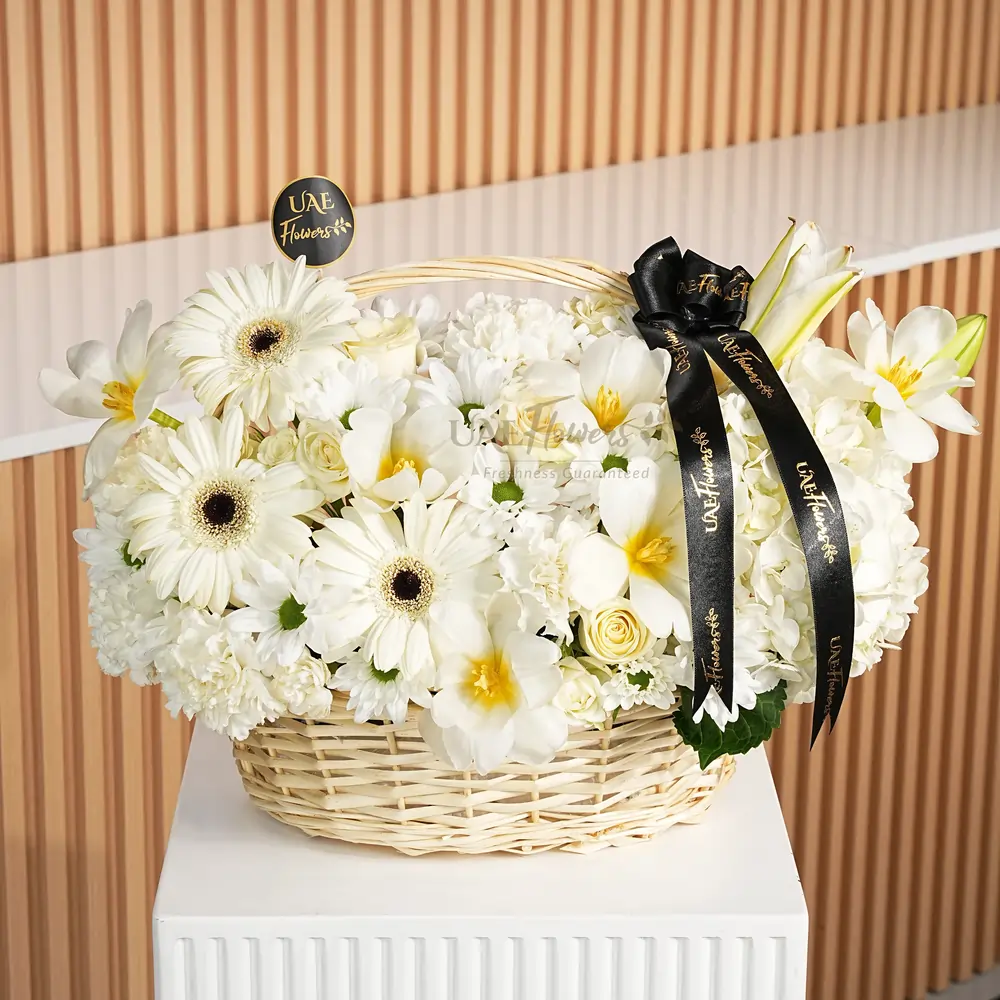 6 white tulips, 1 white hydrangea, 1 lily, 1 Regan chic chrysanthemum, 5 white roses, 3 gerberas, and 8 white carnations