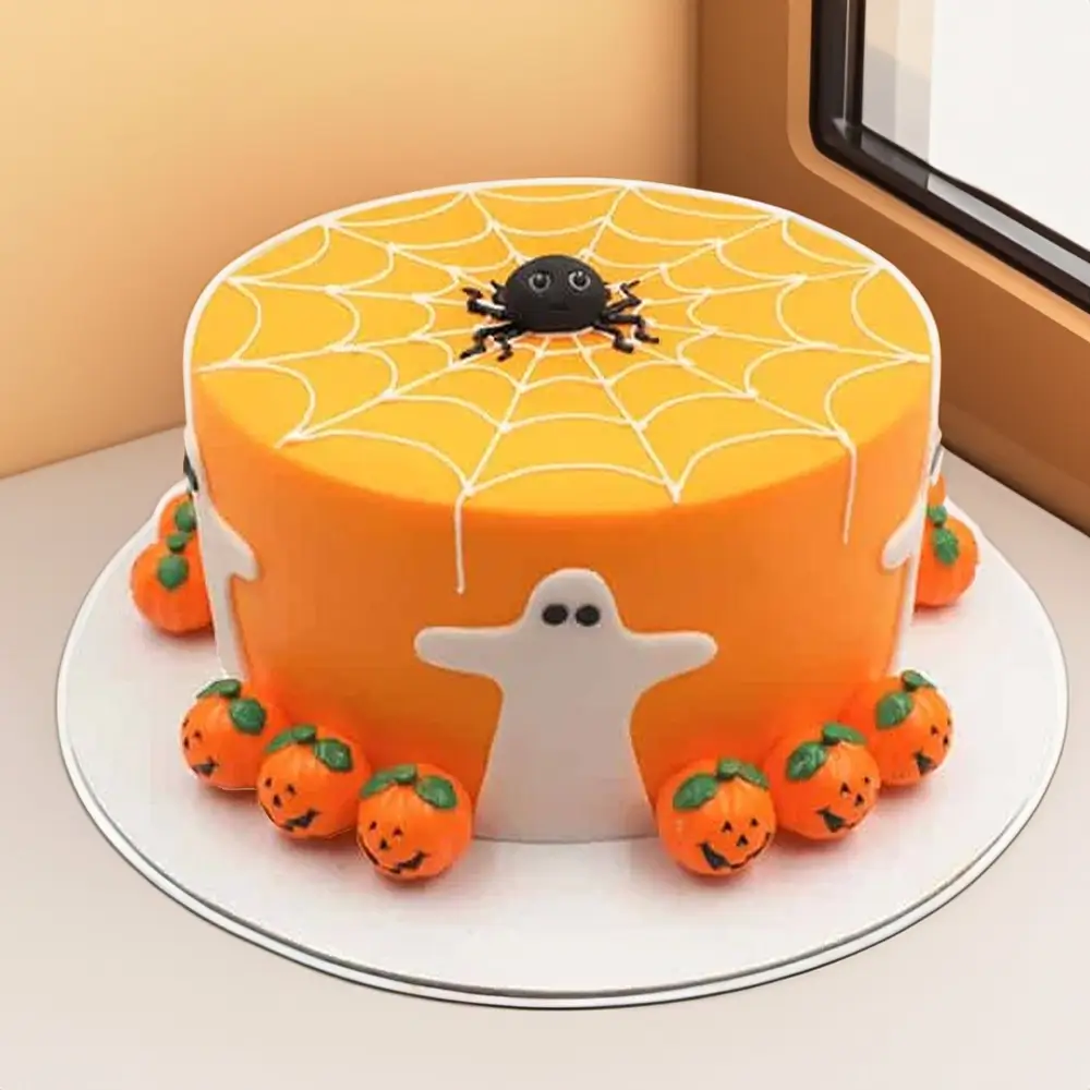 Orange Halloween-themed cake decorated with a spider web design, fondant ghosts, and pumpkin faces, perfect for spooky Halloween parties and celebrations.